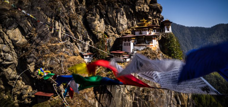Taktsang Monastery view with Prayer flags across the valley